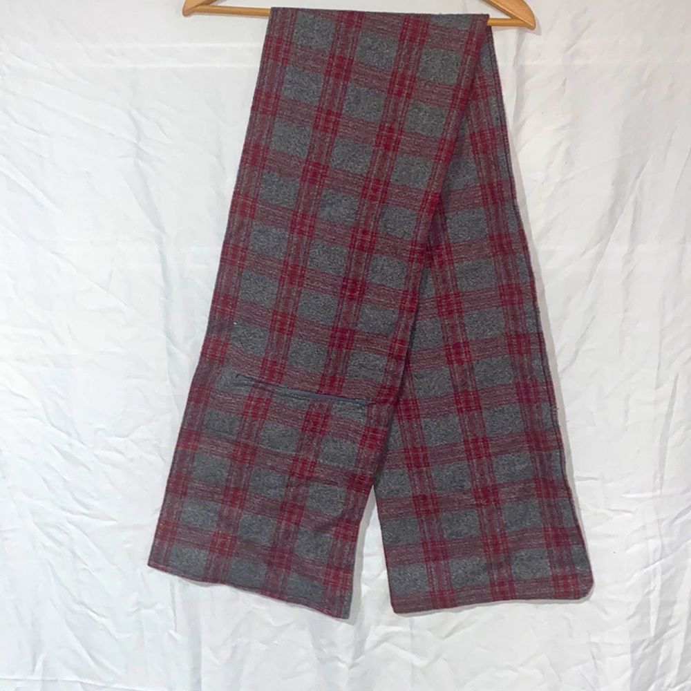 A gray and red plaided scarf